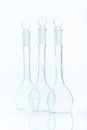 Set of three empty flat-bottomed flasks for measurements Royalty Free Stock Photo