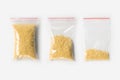 Set of three EMPTY, HALF AND FULL Plastic transparent zipper bag with raw millet groats isolated on white. Vacuum package mockup w