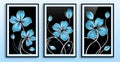 A set of three framed canvases with abstract blue flowers on black background. Wall art decor Royalty Free Stock Photo