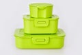 Set of three green plastic food storage containers Royalty Free Stock Photo
