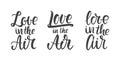 Set of three Handwritten lettering compositions of Love in the Air. Royalty Free Stock Photo