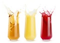 Set of three juices of different taste - cherry, apple and orange - red, yellow and transparent gold in glass, colorful splashes Royalty Free Stock Photo