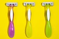 Set of three multi-colored female razors for shaving isolated on white background. Royalty Free Stock Photo
