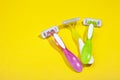 Set of three multi-colored female razors for shaving isolated on white background. Royalty Free Stock Photo