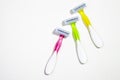 Set of three multi-colored female razors for shaving isolated on white background Royalty Free Stock Photo