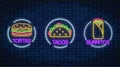 Set of three neon glowing signs of tortas, burritos and tacos in circle frames. Mexican fastfood light billboard symbol.