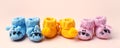 Set three Pairs of baby booties, shoes on pastel background, cozy conceptual idea. Guess gender of the child, baby shower party.