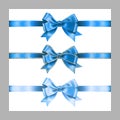 Set of three realistic blue silk ribbon bow with gold glitter shiny stripes, vector illustration elements isolated on white, for Royalty Free Stock Photo