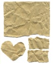 Set of three rectangular and one heart-shaped pieces of brown paper with torn edges as a background Royalty Free Stock Photo