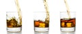 Three glasses with whiskey pouring into them Royalty Free Stock Photo