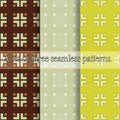 A set of three seamless patterns. Simple geometric prints, curly elements of squares and chevrons Royalty Free Stock Photo