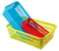 Set of three small colored plastic baskets empty domestic purpos Royalty Free Stock Photo