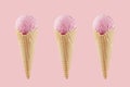 Set of three strawberry ice cream in crisp waffle cones on pastel pink background, mock up for design. Royalty Free Stock Photo