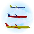 A set of three stylized aircrafts on a light blue sky and clouds background. Vector flat design. Royalty Free Stock Photo