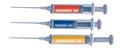 Set of three syringes with a liquid stick of different colors and with different liquid levels inside, isolated object