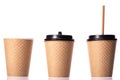 Set of three take away disposable paper cups with black cap and paper straw