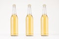 Set of three transparent longneck beer bottle 500ml with lager, mock up. Royalty Free Stock Photo