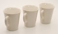 Set of three white mugs