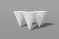 Set of three white paper mockup cups cone shaped on a grey background. 3D rendering Royalty Free Stock Photo