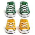 A set of tiny, stylish high-top sneakers in green and yellow, isolated on white background Royalty Free Stock Photo