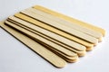 A set of tongue depressors neatly stacked