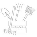 A set of tools for the garden and garden in a box: shovel, rake, pitchfork, broom.