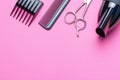 A set of tools for the hairdresser, hairdryer, scissors, comb, on a pink background, copy of the space Royalty Free Stock Photo