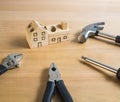 Set of tools and handmade wood house toy. Royalty Free Stock Photo