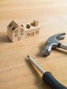 Set of tools and handmade wood house toy. Royalty Free Stock Photo