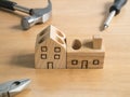 Set of tools and handmade wood house toy. Royalty Free Stock Photo