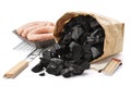 Paper bag of charcoal, grill, sausages. Barbecue preparation set