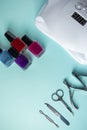 Set of tools for manicure and nail care on blue background. Spa hand procedure, place for text