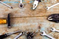 Set of tools over a wooden background with space for text Royalty Free Stock Photo