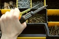 A set of tools in a plastic box, a screwdriver in his hand. Royalty Free Stock Photo