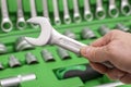 A set of tools for repair in car service - mechanic`s hands, close up. Auto mechanic with working tools for repair and diagnostic Royalty Free Stock Photo