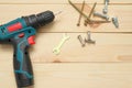 set of tools on wooden table, a electric screwdriver with a set of drill bits and screws with bolts. work tool on wooden Royalty Free Stock Photo