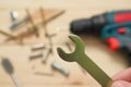 set of tools on wooden table, a electric screwdriver with a set of drill bits and screws with bolts. work tool on wooden Royalty Free Stock Photo