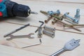 set of tools on wooden table, a electric screwdriver with a set of drill bits and screws with bolts. work tool on wooden Royalty Free Stock Photo