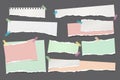 Set of torn white and colorful note, notebook paper strips and pieces stuck with sticky tape on dark grey background Royalty Free Stock Photo