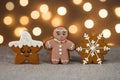 Set of tradition christmas cinnamon cookies: gingerbread man, snowflake and cute star with sugar icing ligths background