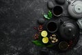 Set traditional Chinese tea on black stone background. Tea in teapot and cup. Top view. Royalty Free Stock Photo