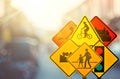 Set of traffic warning sign on blur traffic road with colorful bokeh light abstract background Royalty Free Stock Photo