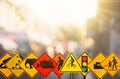 Set of traffic warning sign on blur traffic road with colorful bokeh light abstract background Royalty Free Stock Photo