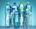 Set of transparent plastic water bottle with blank label. Clear water and natural mineral bottle with white, green, red, and blue Royalty Free Stock Photo