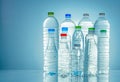 Set of transparent plastic water bottle with blank label. Clear water and natural mineral bottle with white, green, red, and blue Royalty Free Stock Photo