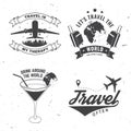 Set of travel badge, logo Travel inspiration quotes with globe, airplane, suitcase and cocktail silhouette. Vector Royalty Free Stock Photo