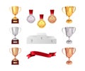 A set of trophies of the winner. Golden, silver and bronze cups, gold medal, red ribbon and pjadestal. Isolated on white backgroun Royalty Free Stock Photo