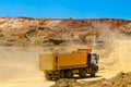 Trucks and the excavator work in career at mining