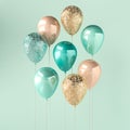 Set of turquoise and golden glossy balloons on the stick with sparkles on blue background. 3D render for birthday, party, wedding