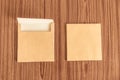 Set of two Brown envelope front and back isolated on wooden table hardwood floor background. Business cards blank. Mockup. Top Royalty Free Stock Photo